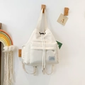 Minimalistische crèmewitte canvas rugzak met trekkoordsluiting en groot voorvak - Wit