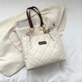 Quilted beige tote bag with dark brown handles and elegant golden chain accents - White & Coffee