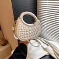 White semi-circular crocodile pattern handbag with hollow round handle and crossbody strap - White