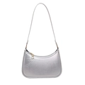 Minimalist silver metallic half-moon underarm bag with sleek shoulder strap on white base - Silver