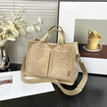 Large beige corduroy tote bag with dual front pockets and adjustable shoulder strap - Khaki