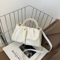 Chic creamy white dumpling bag with elegant pearl handle and soft pleated texture - Off White