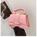 Detail of pink lychee grain leather mini handbag with top handle and metal flap closure - Pink