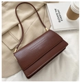 Brown crocodile embossed rectangular flap shoulder bag over a beige blazer - Dark Brown