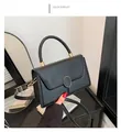 Elegant black faux leather crossbody bag with golden circular ring buckle and top handle - Rose Red