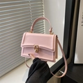 Pink matte leather crossbody bag with gold double-ring lock and top handle strap - Pink
