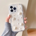 Close-up of iPhone case with pearlescent wave edges and white pearl embellishments - Cream Case-White Glitter Drip-Large & Small Pearls / iPhone 7/8/SE 2020