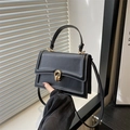 Classic black square crossbody bag in matte PU leather with golden interlocking buckle - Black