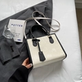 Borsa tote minimalista in pelle bianca e nera con manico superiore e tracolla regolabile - Bianco Sporco