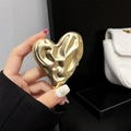 Detailed macro of golden heart phone socket with liquid lava textured metal surface - Transparent Stand / Gold