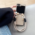 Macro shot of beige lychee leather Z Flip case with cute heart-shaped metal rope hooks - Leather Texture-Bear Ears-Khaki / Samsung ZFlip3