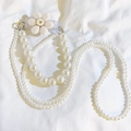 Detail of multilayer pearl chain with white flower clip and metal hooks on fabric - Heart Large Flower Back Clip + Pearl Chain Set (Apricot)