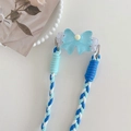 Verstellbare blaue Schleife Handykette mit geflochtenem Seil und Metallringen auf Tisch - Geflochtenes Dreistrang-Seilset / Blau