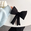 Close-up of a large black bow-knot phone case back clip accessory with soft fabric texture - Black Back Clip Bowknot