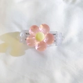 Detail of pink resin flower clip with yellow core and transparent spring mechanism - Back Clip Only / Pink