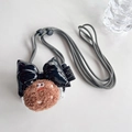 Detail of adjustable black and white braided strap with plush biscuit and leather bow charm - Crossbody Strap Style-Shiny Black Bow-Dark Brown Cookie / Dark Brown & Black