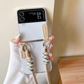Transparente Umhängehülle für Samsung Z Flip mit beige geflochtener Kordel und Ringen - Transparente Hartschale mit beige geflochtenem Seil / Braun / Samsung ZFlip3