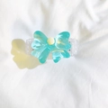 Light blue bow phone clip with white marble texture and yellow bead detail - Bow Back Clip Only / Blue