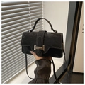 Detail of the black crinkled leather crossbody bag with silver buckle and handle - Black