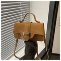 Detail of mustard yellow wrinkled leather handbag with a silver metal buckle closure - Brown