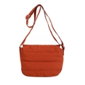 Quilted burnt orange crossbody tote bag with adjustable strap and casual puffer texture - Orange