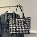 Large checkered tote bag with heart patterns and black leather straps on a hanger - Heart Plaid White