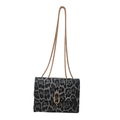 Retro leopard print crossbody bag with gold chain strap and decorative oval buckle - Black