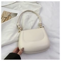 Close-up of creamy white shoulder bag featuring a knotted strap and gold sphere hardware - Off White