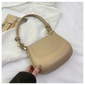 Detail view of beige saddle bag with knotted shoulder strap and gold hardware - Khaki