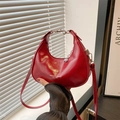 Glossy red crescent shoulder bag with silver zipper and bear charm pendant - Red