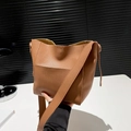 Brown lychee leather bucket bag with wide shoulder strap in minimalist stylish design - Brown