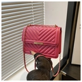 Detail of rose red crossbody bag with chevron quilting and golden chain strap - Rose Pink