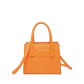 Orange faux leather handbag featuring embossed diamond patterns and a detachable strap - Orange