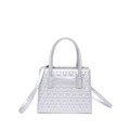 Silver faux leather handbag with geometric diamond embossing and cylindrical handles - Silver