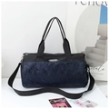Detail of camoufalge travel bag with adjustable strap and durable nylon material - Black