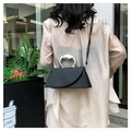 Black leather crossbody bag featuring an artistic silver liquid-metal handle detail - Black