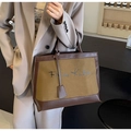 Vintage olive green canvas tote bag with dark brown leather trim and cursive text - Brown
