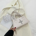 Minimalist cream white trapezoid crossbody bag with a silver star accent and top handle - Beige