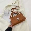 Minimalist brown leather trapezoid handbag with silver star detail and shoulder strap - Brown