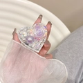 Detail of heart-shaped phone grip with purple resin roses, pearls, and rhinestones - Purple