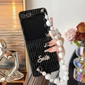 Detail of black pleated leather phone case with Smile lettering and pearl lanyard - Black / OPPO Find N3 Flip