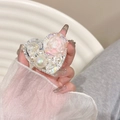 Close-up of heart-shaped phone grip with pink resin rose, pearls and rhinestones - Pink