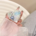 Detail of heart-shaped phone grip with blue resin rose, pearls and rhinestones - Blue