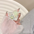 Detail view of heart-shaped phone grip with resin rose pearl and sparkling rhinestones - Green