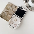 Detail of white leather texture phone case with pearl chain and metallic floral charms - White / Samsung ZFlip3