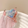 Detail eines Herz-Handyhalters mit blauen Glitzer-Pailletten und Love-Schriftzug aus Strass - Transparenter Herz Treibsand Strass Love