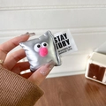 Close-up of cute big-eyed silver pillow phone grip with plush nose and woven tag - Silver
