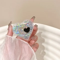 Close-up of heart-shaped phone grip with glitter sand and gold rhinestone heart detail - Transparent Heart Quicksand Rhinestone Double Heart