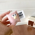 Close-up of cute pink plush phone grip with big eyes and fluffy yellow pom-pom nose - Pink