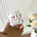 Detailed view of the soft white plush bear case with pink embroidered ears and nose - Bear
